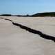 Hurricane Sandy flattened protective dunes between Launchpads 39A and 39B, resulting in millions of dollars of shoreline reparations. Photo: NASA.